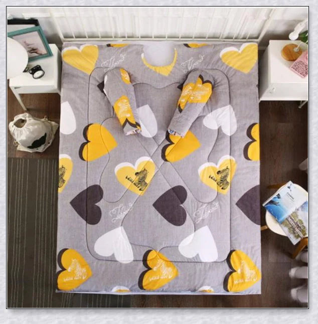 A cozy, wearable lazy quilt with sleeves in gray, providing hands-free warmth and comfort for relaxation and outdoor activities.