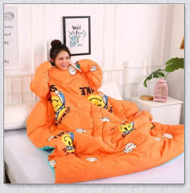 A cozy, wearable lazy quilt with sleeves in gray, providing hands-free warmth and comfort for relaxation and outdoor activities.