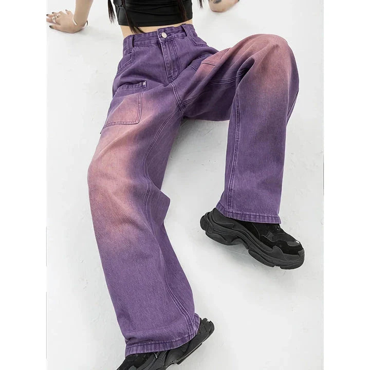 A pair of high-waisted, purple wide-leg jeans with a chic and contemporary silhouette, perfect for any fashionable occasion.