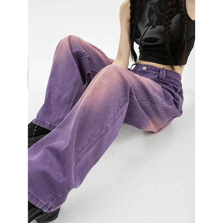 A pair of high-waisted, purple wide-leg jeans with a chic and contemporary silhouette, perfect for any fashionable occasion.