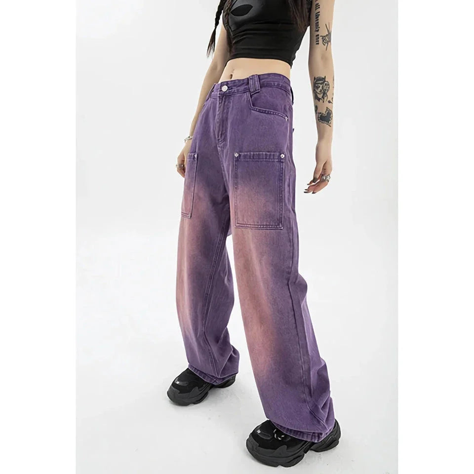 A pair of high-waisted, purple wide-leg jeans with a chic and contemporary silhouette, perfect for any fashionable occasion.