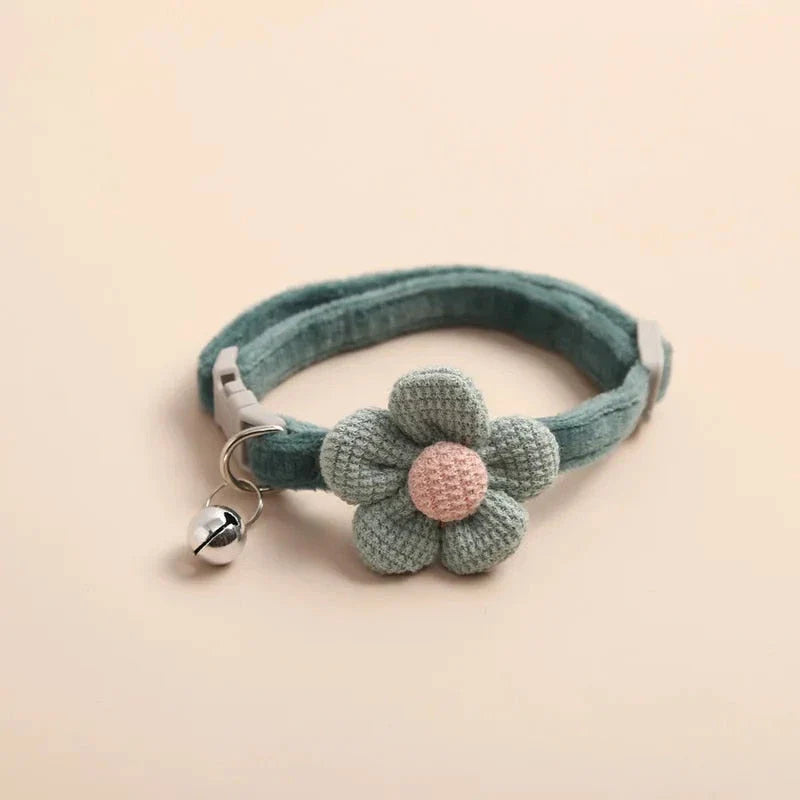 A soft, plush flannelette collar with a cartoon-style flower design and a bell to help locate your pet.