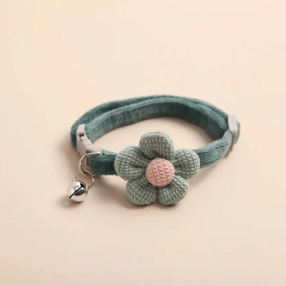 A soft, plush flannelette collar with a cartoon-style flower design and a bell to help locate your pet.