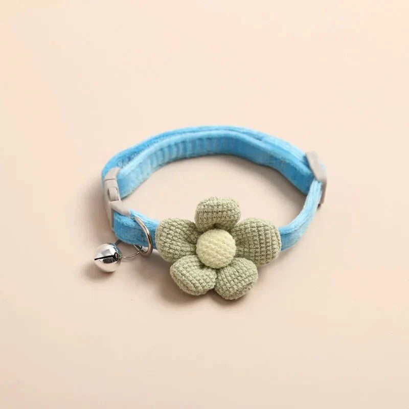 A soft, plush flannelette collar with a cartoon-style flower design and a bell to help locate your pet.