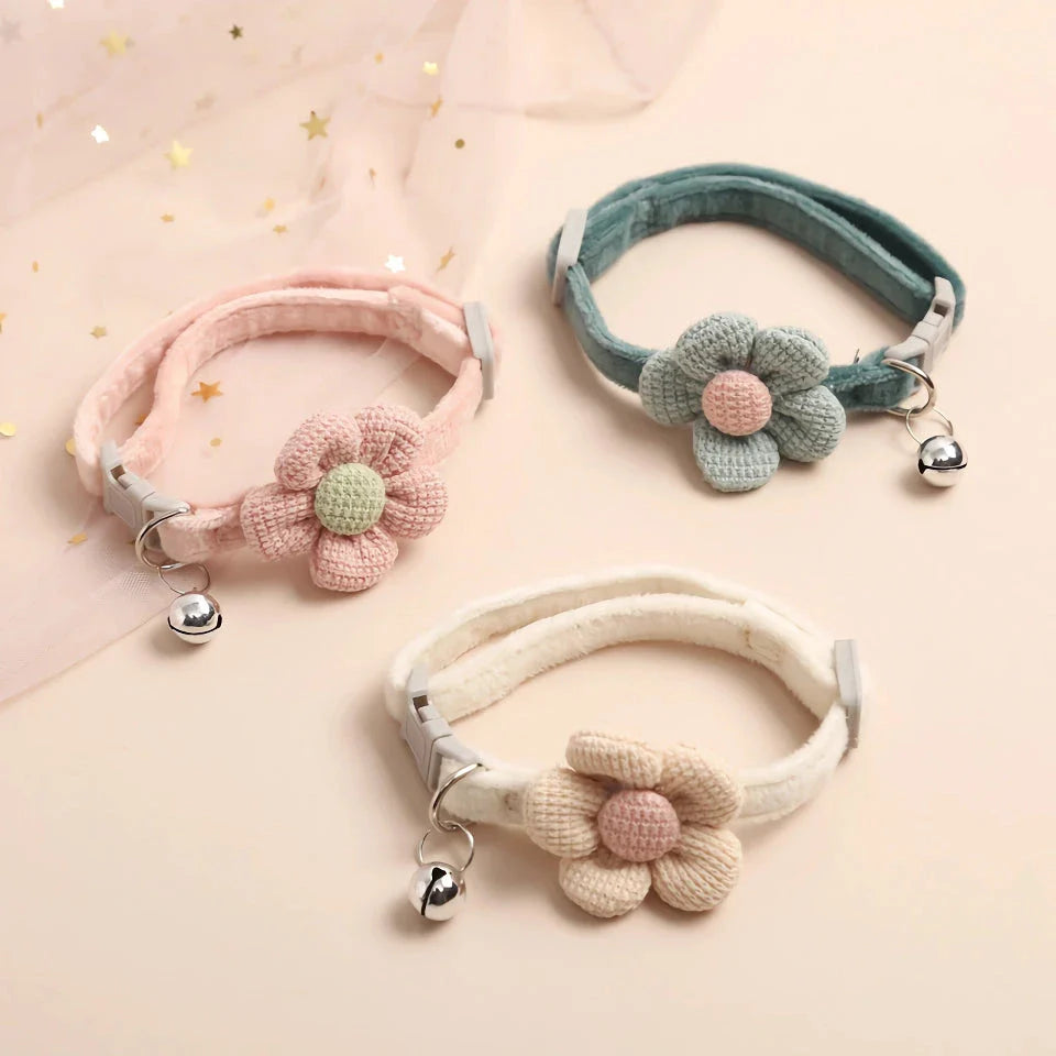 A soft, plush flannelette collar with a cartoon-style flower design and a bell to help locate your pet.