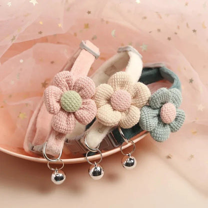 A soft, plush flannelette collar with a cartoon-style flower design and a bell to help locate your pet.