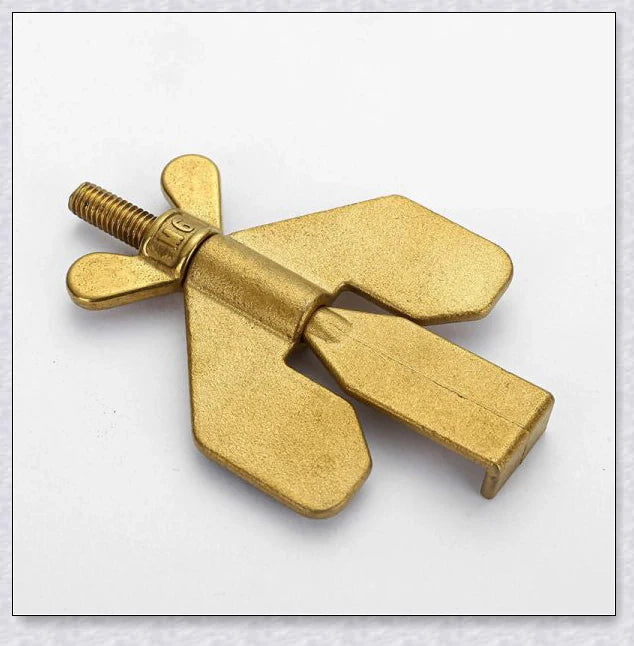 Portable Hotel Door Lock in black and gold colors, a compact and secure travel security device for hotels, dorms, and apartments.