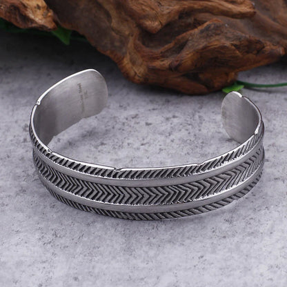 A stainless steel bracelet with a classic, geometric design in a silver finish