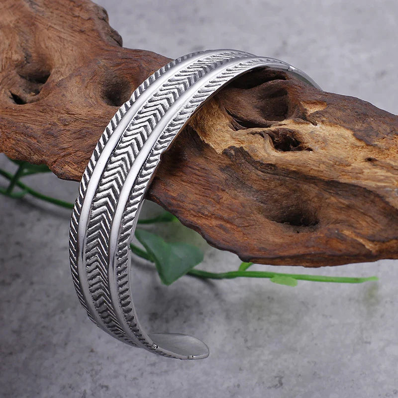 A stainless steel bracelet with a classic, geometric design in a silver finish