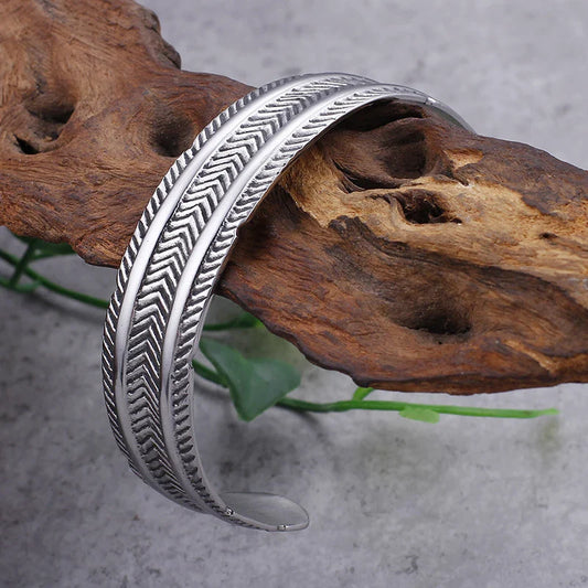 A stainless steel bracelet with a classic, geometric design in a silver finish
