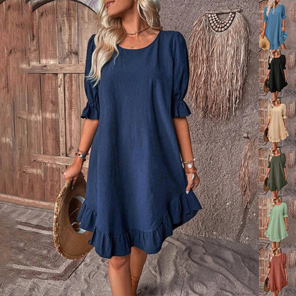 A women's summer dress with a ruffle detail and a loose, straight silhouette in a solid color