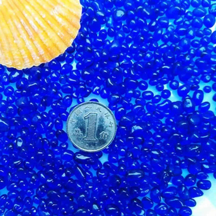 Premium blue gravel for aquarium decoration, featuring vibrant shades and a smooth texture to create a serene and calming underwater environment.