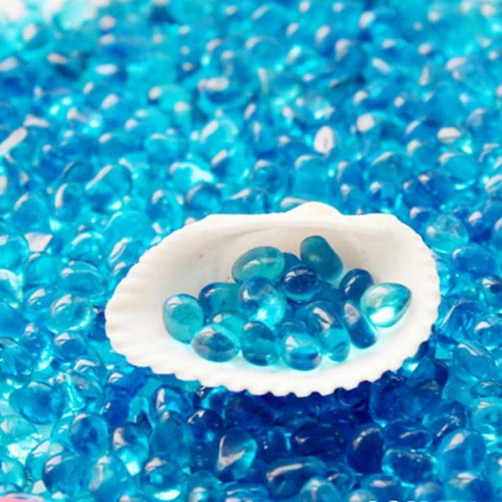 Premium blue gravel for aquarium decoration, featuring vibrant shades and a smooth texture to create a serene and calming underwater environment.