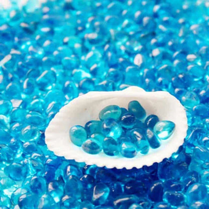 Premium blue gravel for aquarium decoration, featuring vibrant shades and a smooth texture to create a serene and calming underwater environment.