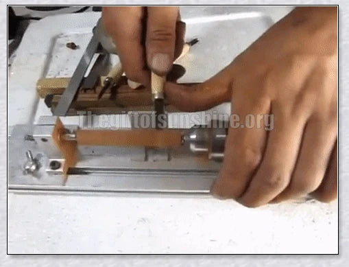 A compact, powerful mini woodworking lathe with a sleek silver design and various accessories for creating intricate wood carvings and projects.