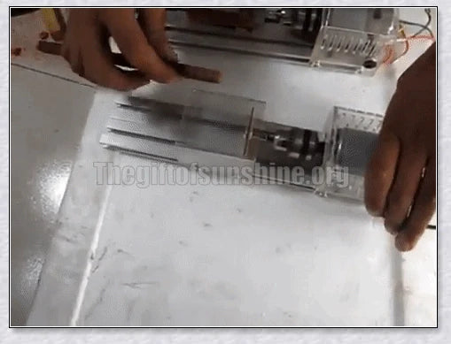 A compact, powerful mini woodworking lathe with a sleek silver design and various accessories for creating intricate wood carvings and projects.