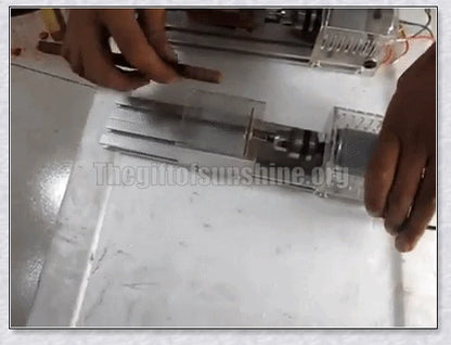 A compact, powerful mini woodworking lathe with a sleek silver design and various accessories for creating intricate wood carvings and projects.