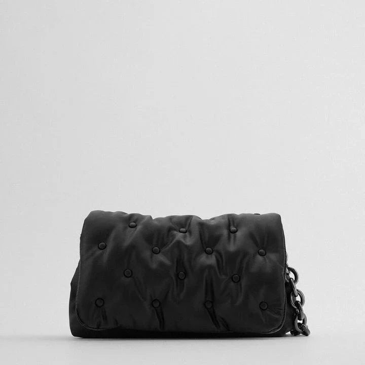 Blue oversized denim quilted shoulder messenger bag with chain strap and multiple interior pockets for organization