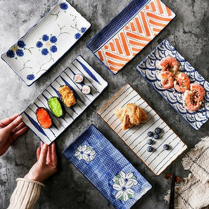 Japanese-inspired ceramic plate with blue and orange color design, featuring a gently curved shape for enhanced presentation of meals.