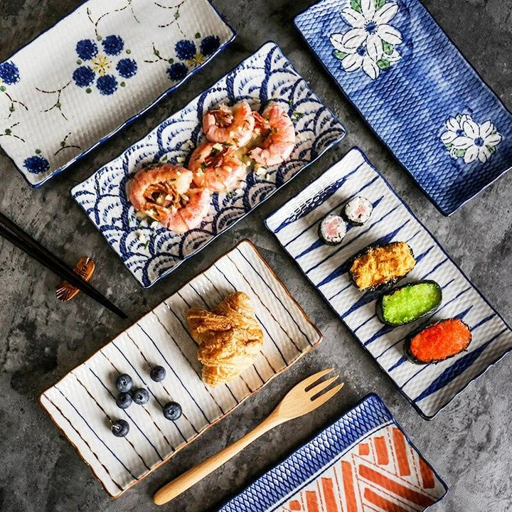 Japanese-inspired ceramic plate with blue and orange color design, featuring a gently curved shape for enhanced presentation of meals.