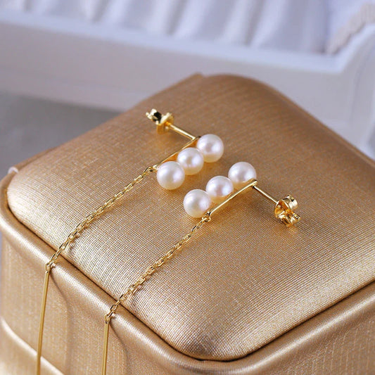 Elegant silver earrings featuring natural pearls for a sophisticated, timeless look