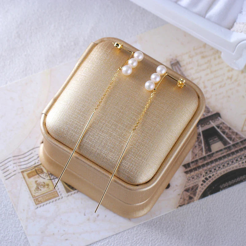 Elegant silver earrings featuring natural pearls for a sophisticated, timeless look