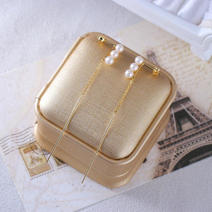 Elegant silver earrings featuring natural pearls for a sophisticated, timeless look