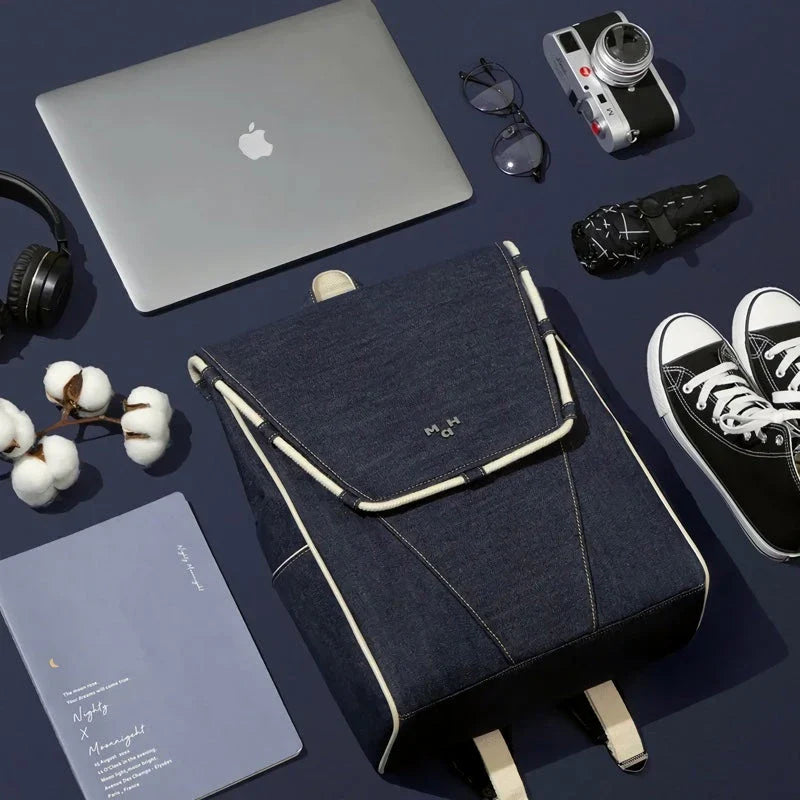 Eco-Friendly Active Denim Waterproof Backpack with multiple interior pockets, waterproof lining, and comfortable hard handle