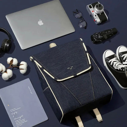 Eco-Friendly Active Denim Waterproof Backpack with multiple interior pockets, waterproof lining, and comfortable hard handle