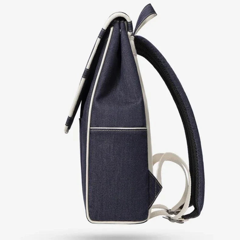 Eco-Friendly Active Denim Waterproof Backpack with multiple interior pockets, waterproof lining, and comfortable hard handle