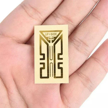 Gold-colored cell phone signal enhancement sticker booster for improved reception and reduced static