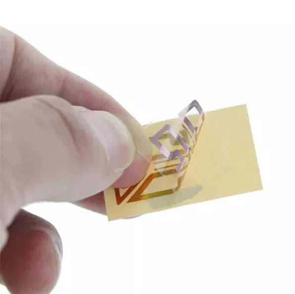 Gold-colored cell phone signal enhancement sticker booster for improved reception and reduced static