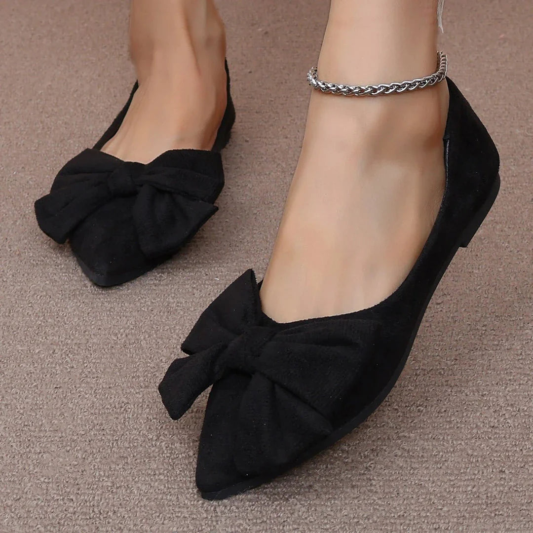 Fashionable flat shoes with bow accent, pointed toe, and low heel for comfortable, slip-on wear