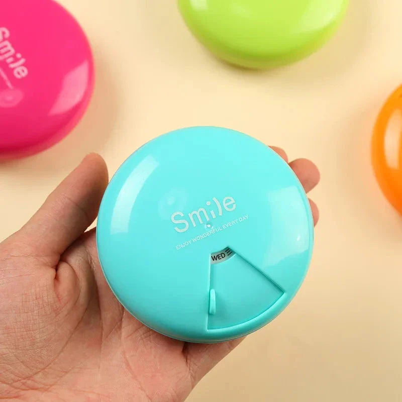 Compact Portable Travel Pill Organizer with seven labeled compartments for organizing daily medications and supplements