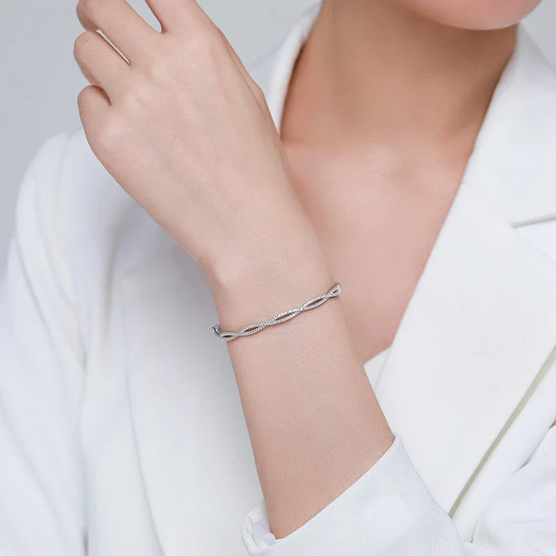 Elegant silver bracelet with a captivating wave-like design, a premium micro-set jewelry piece crafted with superior Seiko technology