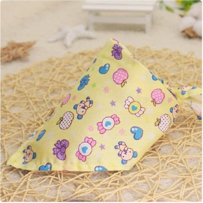 Adorable Cartoon Patterned Triangular Dog Scarf in vibrant colors, perfect for keeping your pup warm and stylish