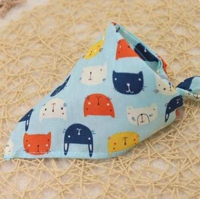 Adorable Cartoon Patterned Triangular Dog Scarf in vibrant colors, perfect for keeping your pup warm and stylish