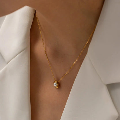 Elegant stainless steel pearl pendant necklace with a geometric design, perfect for women's fashion and everyday style.