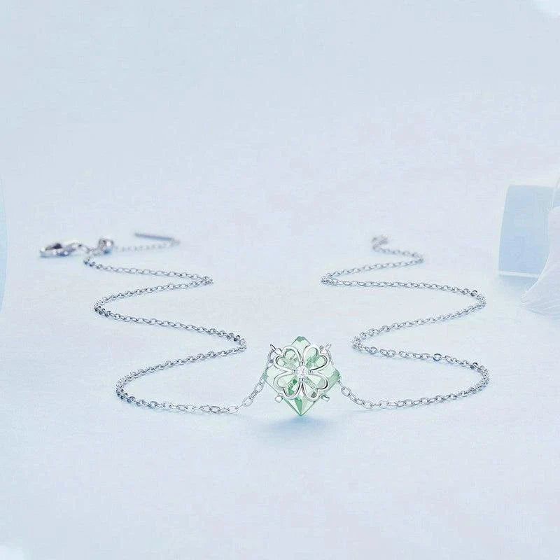 Elegant platinum-plated adjustable green pendant necklace with a sleek, silver-toned chain and a stylish green pendant