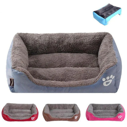 A plush, green pet bed with a paw-print pattern, designed to provide cozy and waterproof comfort for pets.