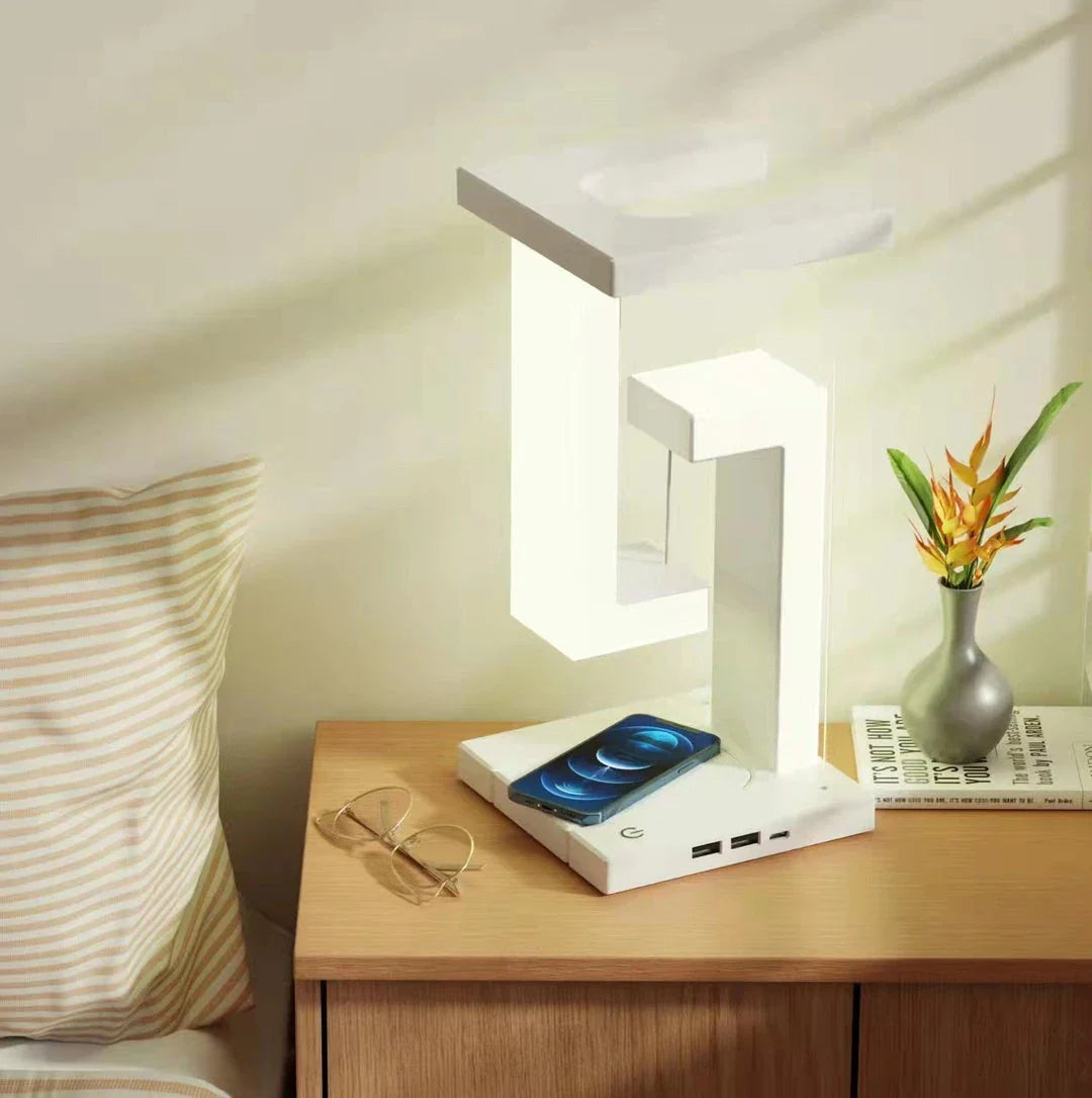 A modern, levitating desk lamp with wireless charging capabilities for smartphones