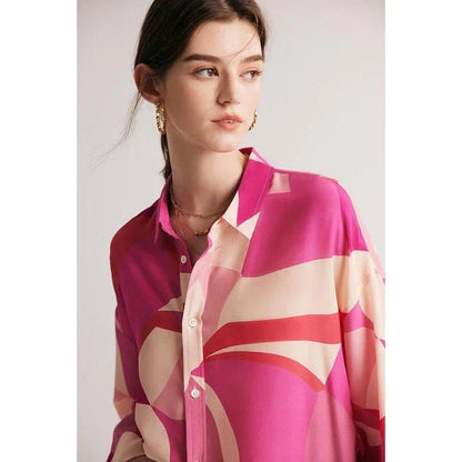 Elegant silk crepe de chine blouse in a unique print design, featuring a loose, straight fit and full-length drop sleeves for a modern, sophisticated look.