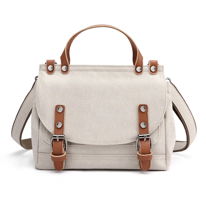 A stylish women's canvas crossbody handbag in an orange color, featuring a small square shape and a horizontal design.