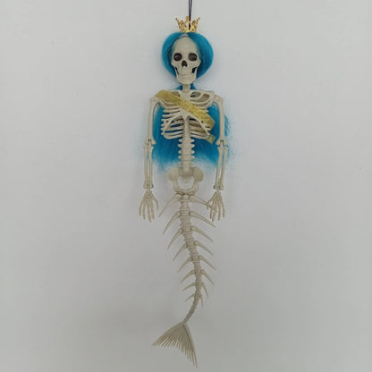 Mermaid bone pendant in various colors, including brown, dark purple, burgundy, and lake blue, hanging outdoors for Halloween decoration