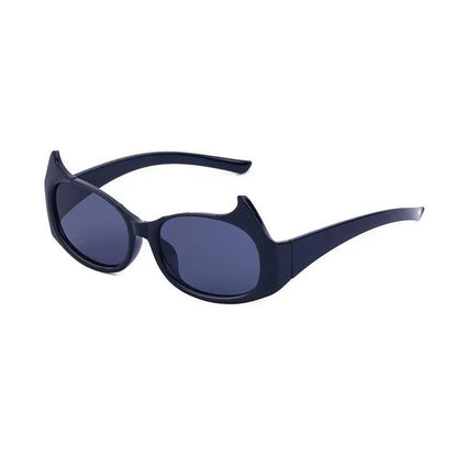 Stylish cat-eye sunglasses with oversized frames, semi-rimless design, and punk-inspired detailing for a timeless, glamorous look