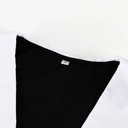 Black and white color-blocked dress with long sleeves and a doll collar, showcasing a timeless and sophisticated style.