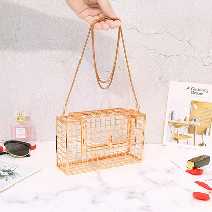 Metal shoulder bag with iron mesh design, adjustable chain strap, and compact size for versatile wear