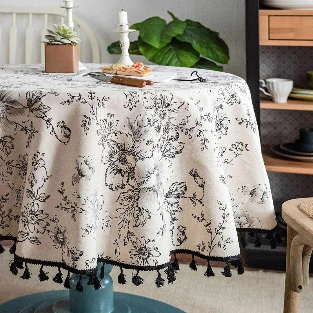 Elegant floral cotton linen round tablecloth with tassels, perfect for dining, kitchen, and home decor