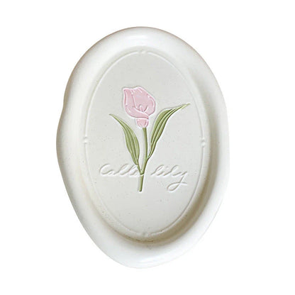 Elegant ceramic plate featuring a delicate floral relief design of Calla Lily and Tulip flowers, perfect for refined dining