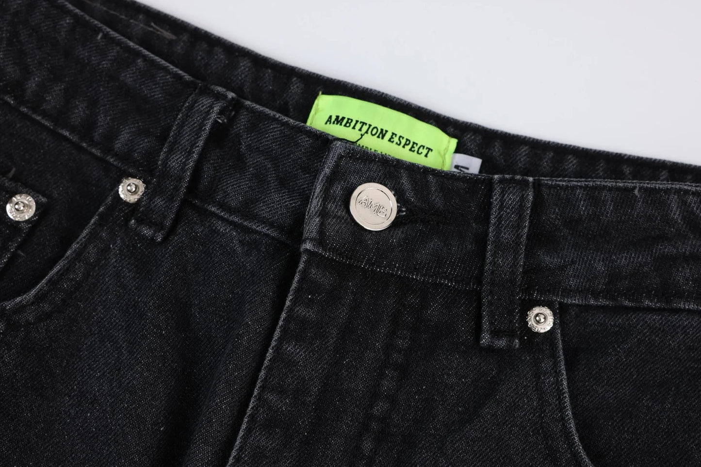 Premium loose fit distressed denim trousers for men and women, featuring a relaxed silhouette, high-quality cotton construction, and trendy distressed details.